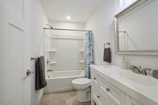 full bathroom featuring shower / bath combo with shower curtain, vanity, and toilet