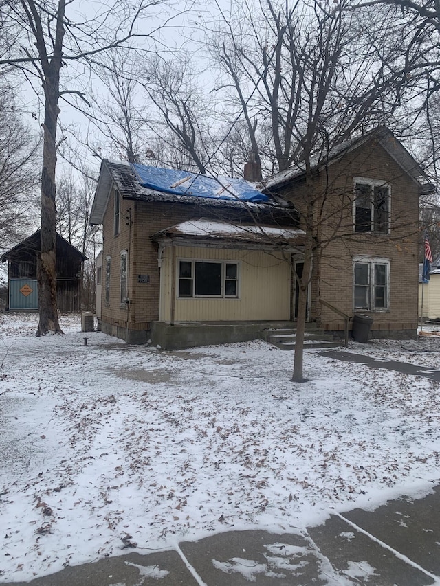 view of snow covered house