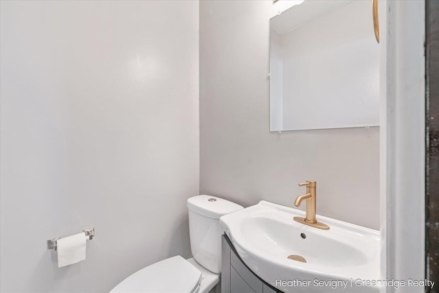 bathroom with vanity and toilet