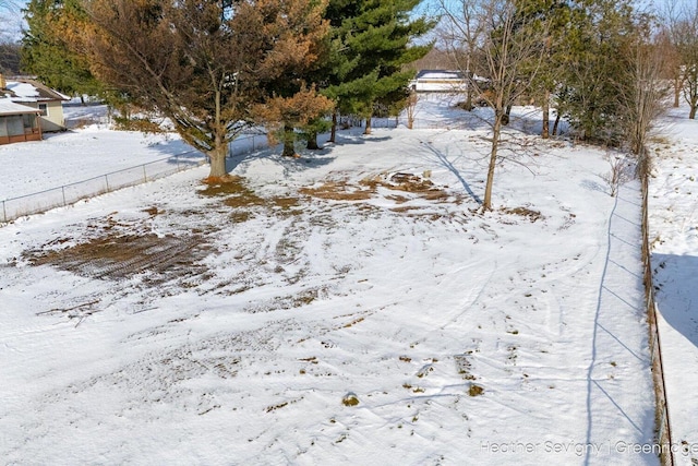 view of yard layered in snow