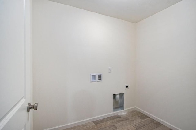 washroom with hookup for a washing machine, electric dryer hookup, and light hardwood / wood-style flooring