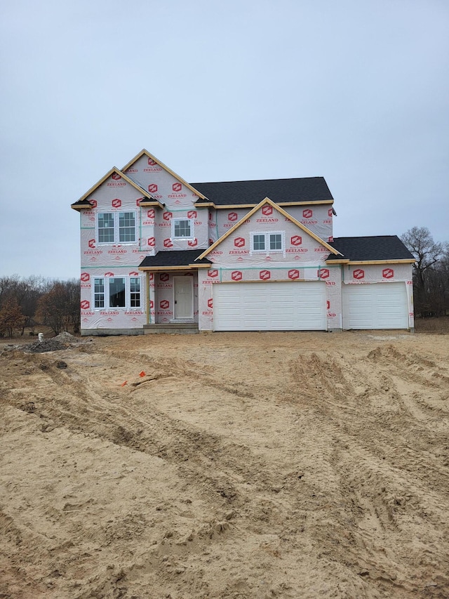 property in mid-construction featuring driveway and a garage