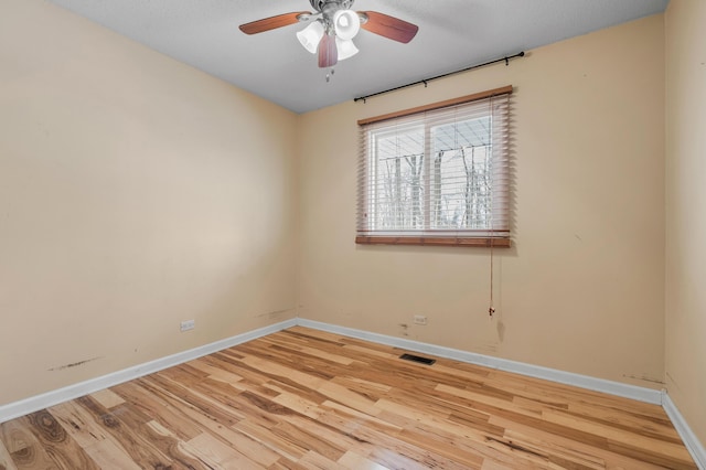 unfurnished room featuring light hardwood / wood-style floors and ceiling fan