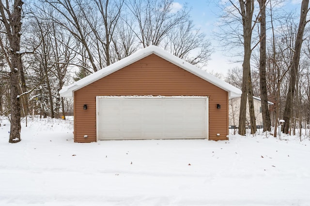 view of snow covered garage