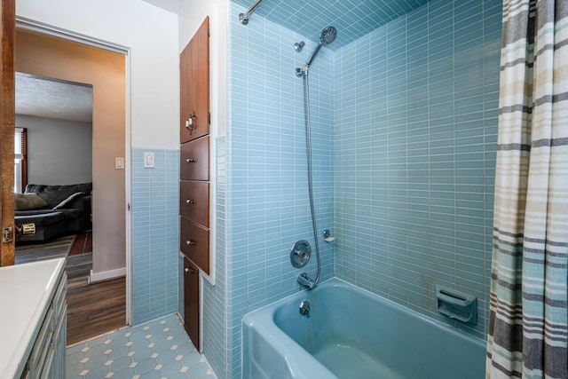 bathroom with shower / tub combo and wood-type flooring