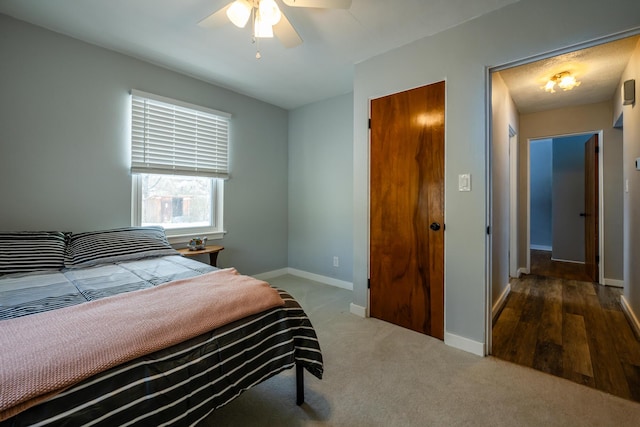 bedroom with wood-type flooring and ceiling fan