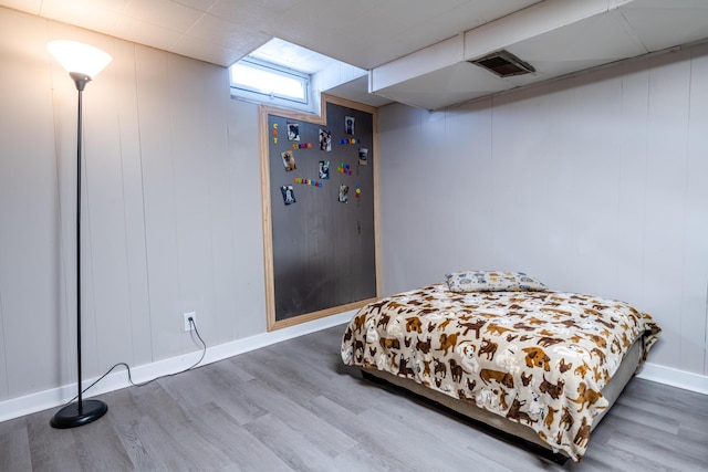 bedroom featuring hardwood / wood-style floors