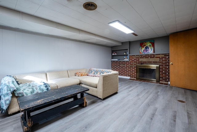 living room featuring a fireplace and hardwood / wood-style floors