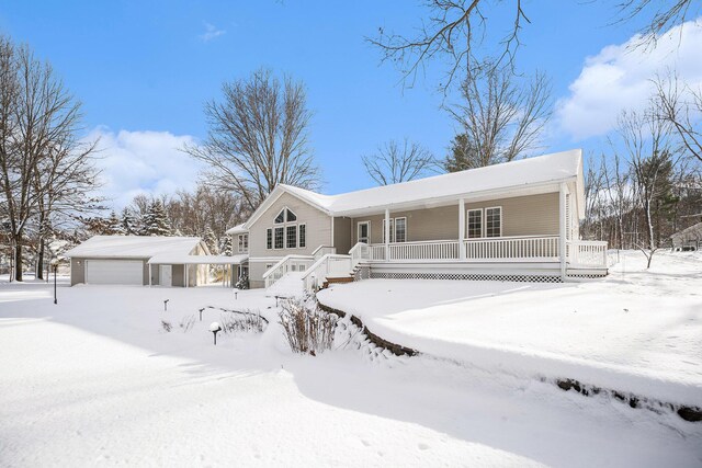 view of front of home featuring a garage and an outdoor structure