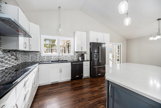 kitchen with dark hardwood / wood-style flooring, white cabinets, decorative light fixtures, and appliances with stainless steel finishes