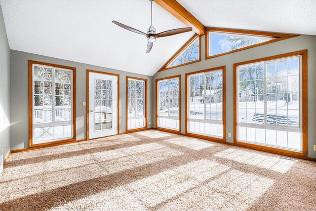 unfurnished sunroom with lofted ceiling with beams and ceiling fan