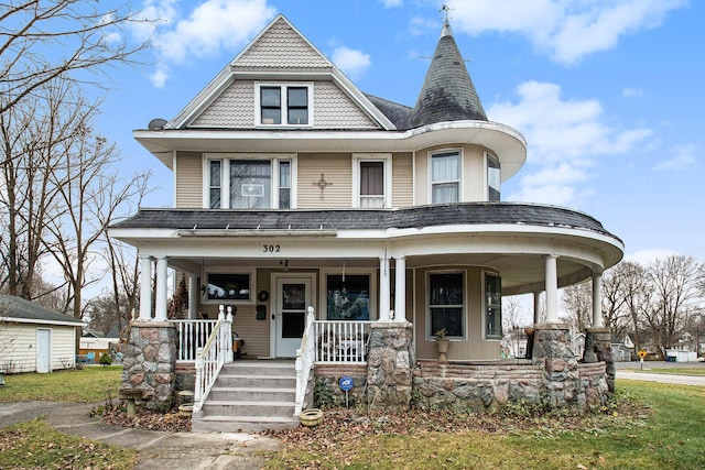 victorian-style house featuring covered porch