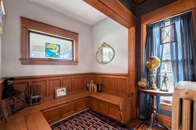 sitting room featuring wood walls