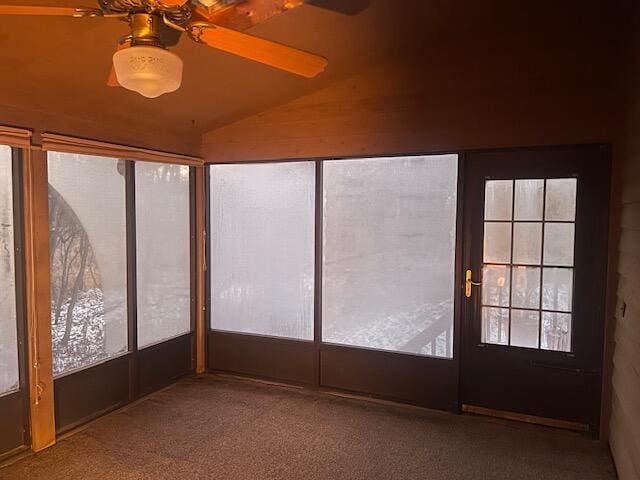 unfurnished sunroom with ceiling fan, french doors, and vaulted ceiling