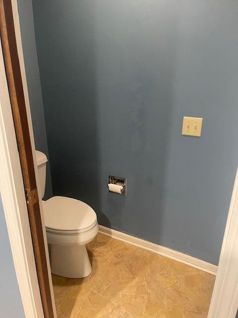 bathroom with tile patterned floors and toilet