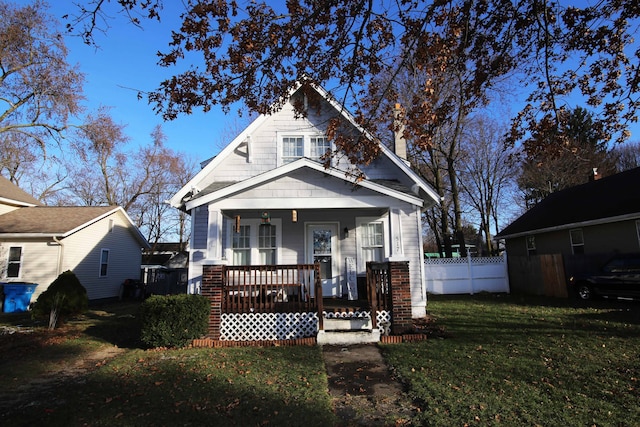 view of front of home featuring a porch and a front yard