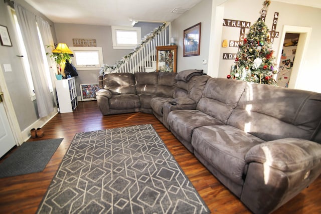 living room featuring dark wood-type flooring