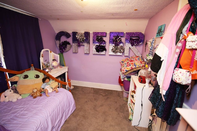 carpeted bedroom featuring a textured ceiling