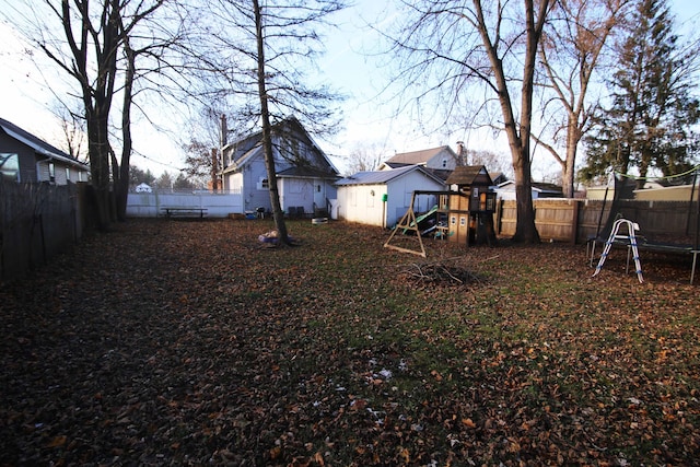 view of yard with a playground and an outdoor structure