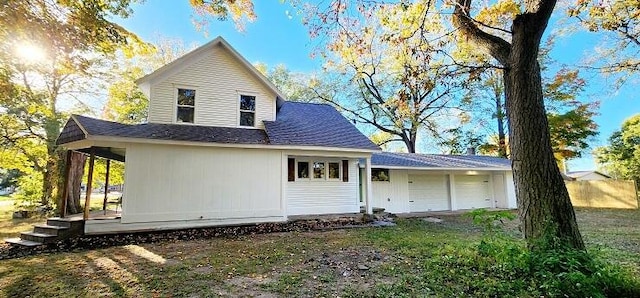 back of house with a garage