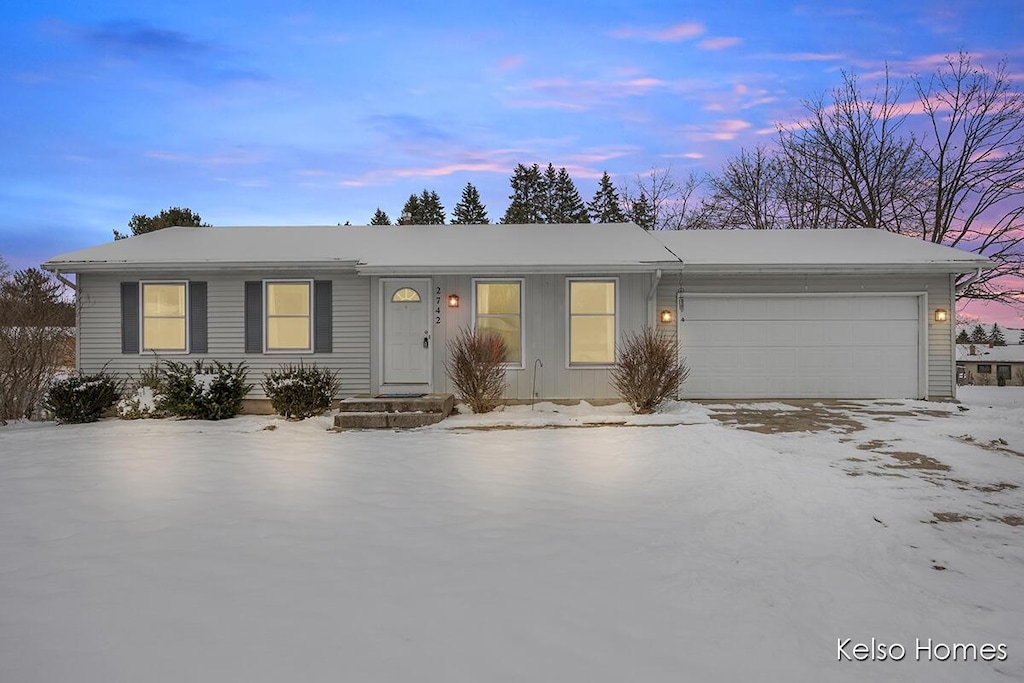 single story home featuring a garage