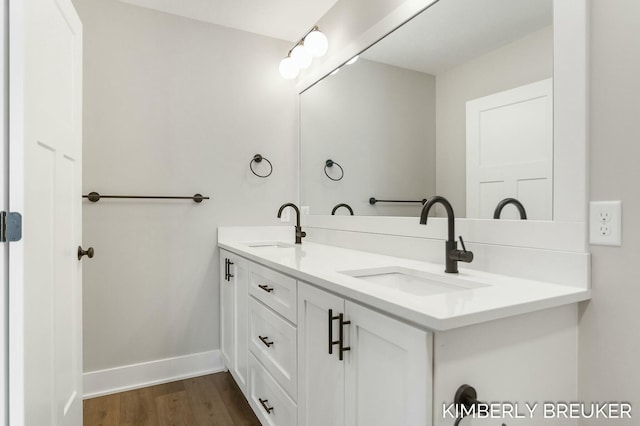 bathroom featuring hardwood / wood-style floors and vanity