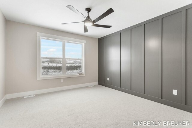 unfurnished bedroom featuring carpet and ceiling fan