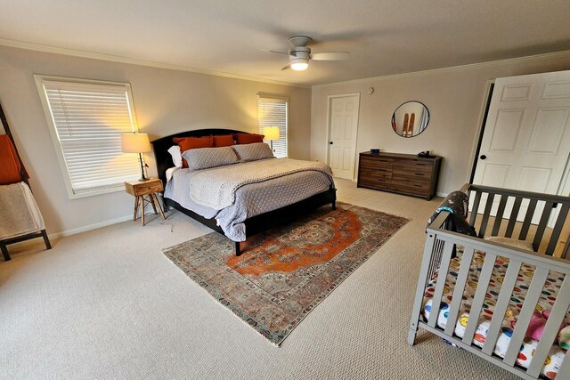 carpeted bedroom with ceiling fan and crown molding