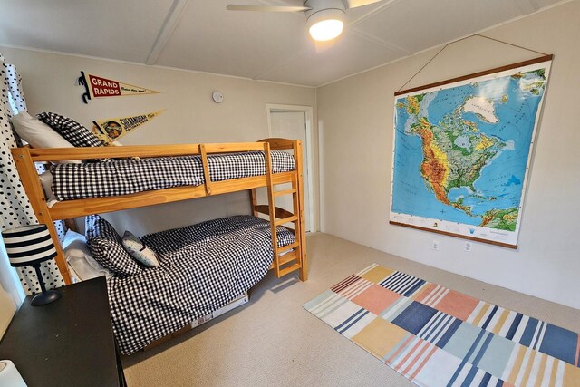 bedroom with light colored carpet and ceiling fan