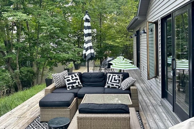 wooden terrace with outdoor lounge area