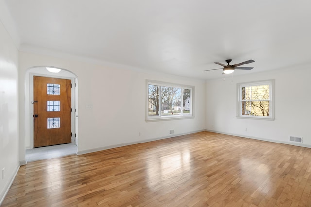 foyer with light hardwood / wood-style floors, plenty of natural light, and ceiling fan