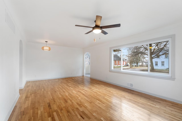 spare room with light hardwood / wood-style flooring and ceiling fan