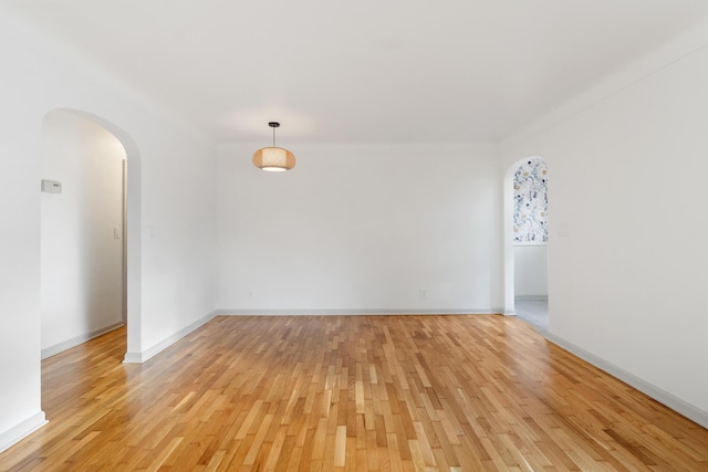 empty room with light hardwood / wood-style floors