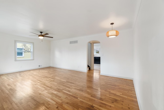 spare room featuring ceiling fan and light hardwood / wood-style flooring