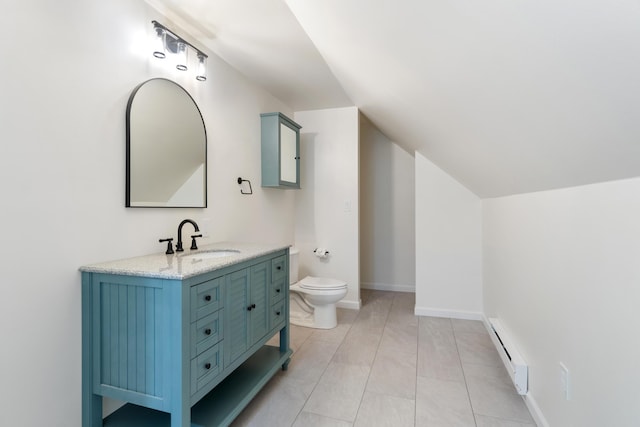 bathroom with vanity, toilet, lofted ceiling, and a baseboard radiator