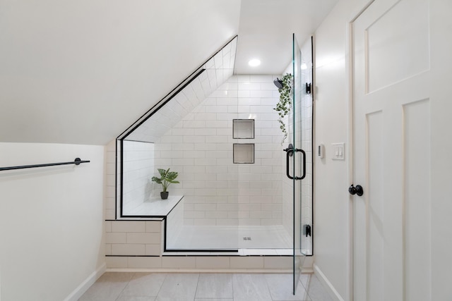 bathroom with tile patterned floors and a shower with shower door