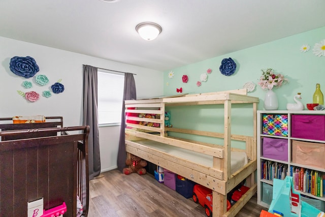 bedroom with hardwood / wood-style flooring