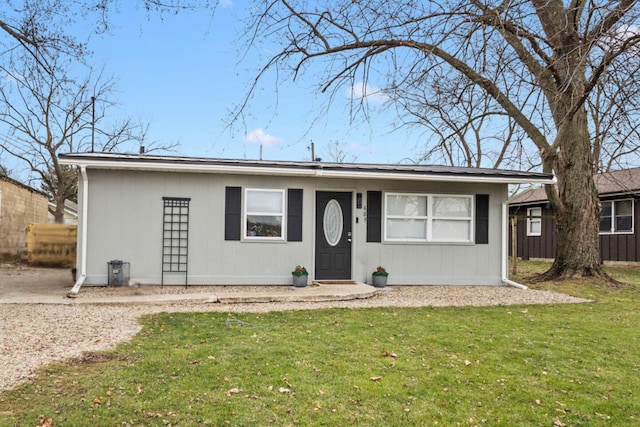 single story home featuring a front yard