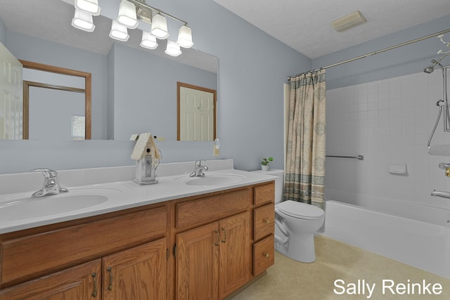 full bathroom with vanity, shower / tub combo with curtain, a textured ceiling, and toilet