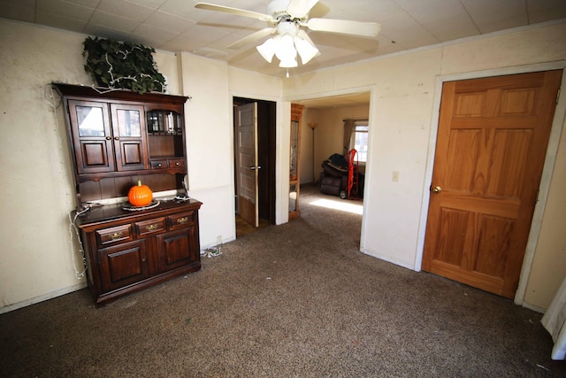 hallway featuring dark colored carpet