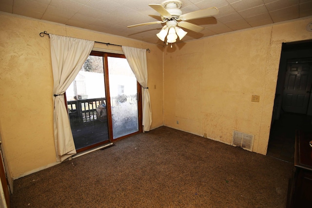 carpeted empty room featuring ceiling fan