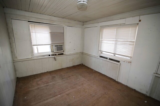 unfurnished room with cooling unit