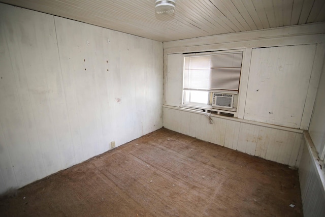 spare room with wooden walls