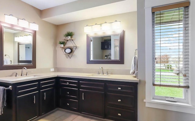 bathroom with tile patterned floors and vanity