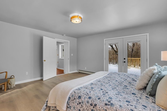 bedroom with access to exterior, dark wood-type flooring, a baseboard radiator, and french doors