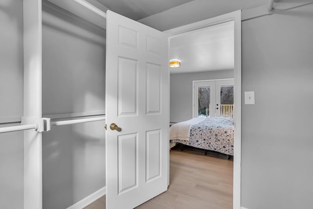 bedroom featuring light hardwood / wood-style floors and french doors