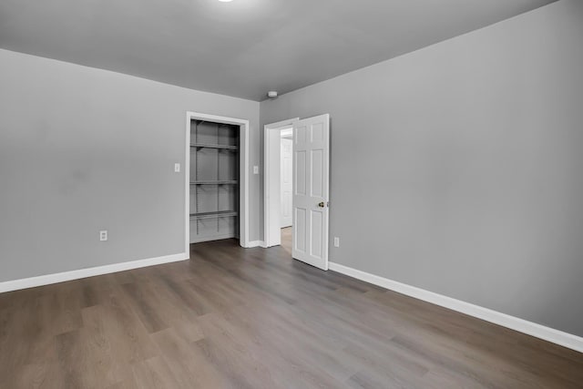 unfurnished bedroom featuring hardwood / wood-style flooring