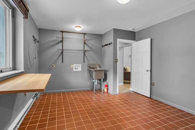 laundry area featuring hookup for a washing machine and tile patterned flooring