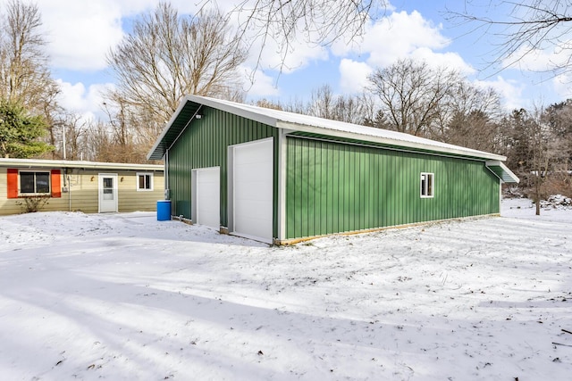 view of snow covered garage