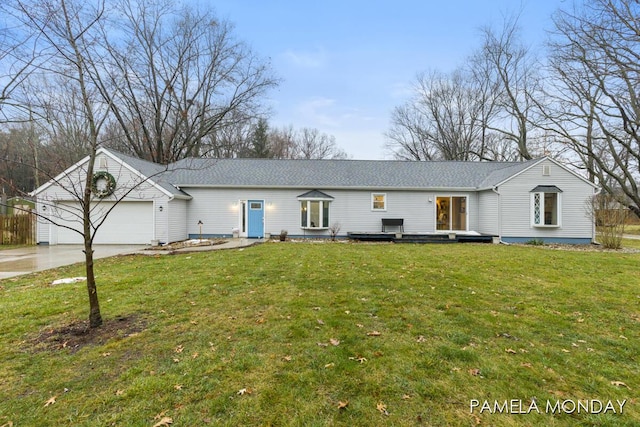 single story home featuring a front yard and a garage